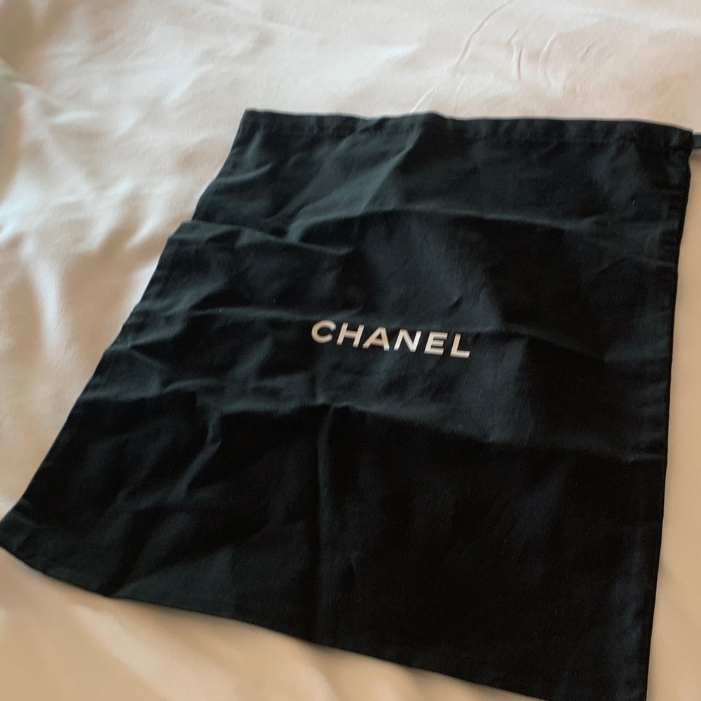 Authentic Chanel dust bag with strings, mid size , brand new condition.